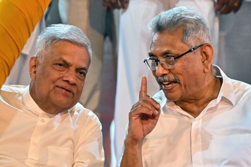 Sri Lanka's President Ranil Wickremesinghe (L) sits with his predecessor Gotabaya Rajapaksa. Both men spent massive amounts of political capital to renegotiate the billions of dollars their nation owes China – an amount that has plunged Sri Lanka into economic chaos. 