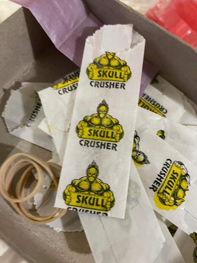 A recent bust in The Bronx turned up glassine bags branded with the dealer's "Skull Crusher" logo.