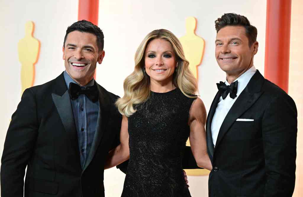 Mark Consuelos, TV host Kelly Ripa and Ryan Seacrest