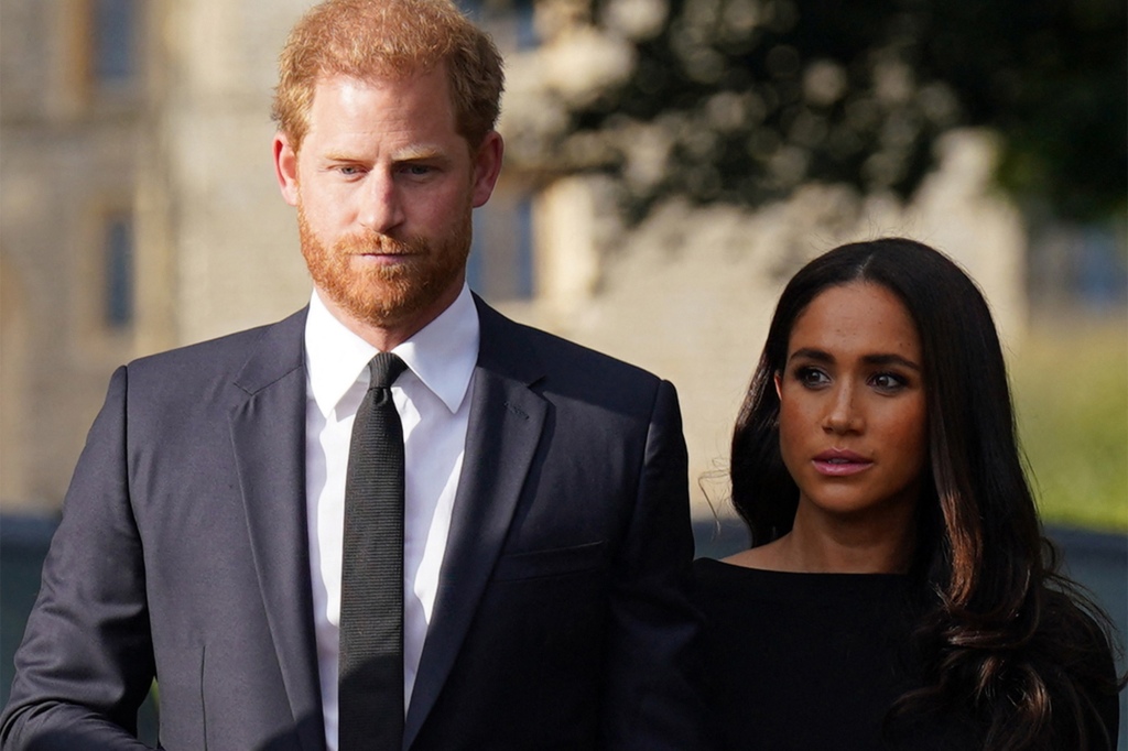 Britain's Prince Harry and Meghan, Duchess of Sussex on the long Walk at Windsor Castle.