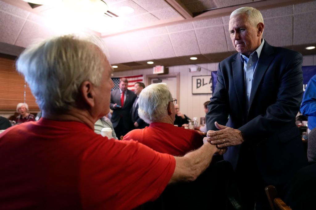 Former Vice President Mike Pence greets an audience member at the Westside Conservative Club Breakfast.