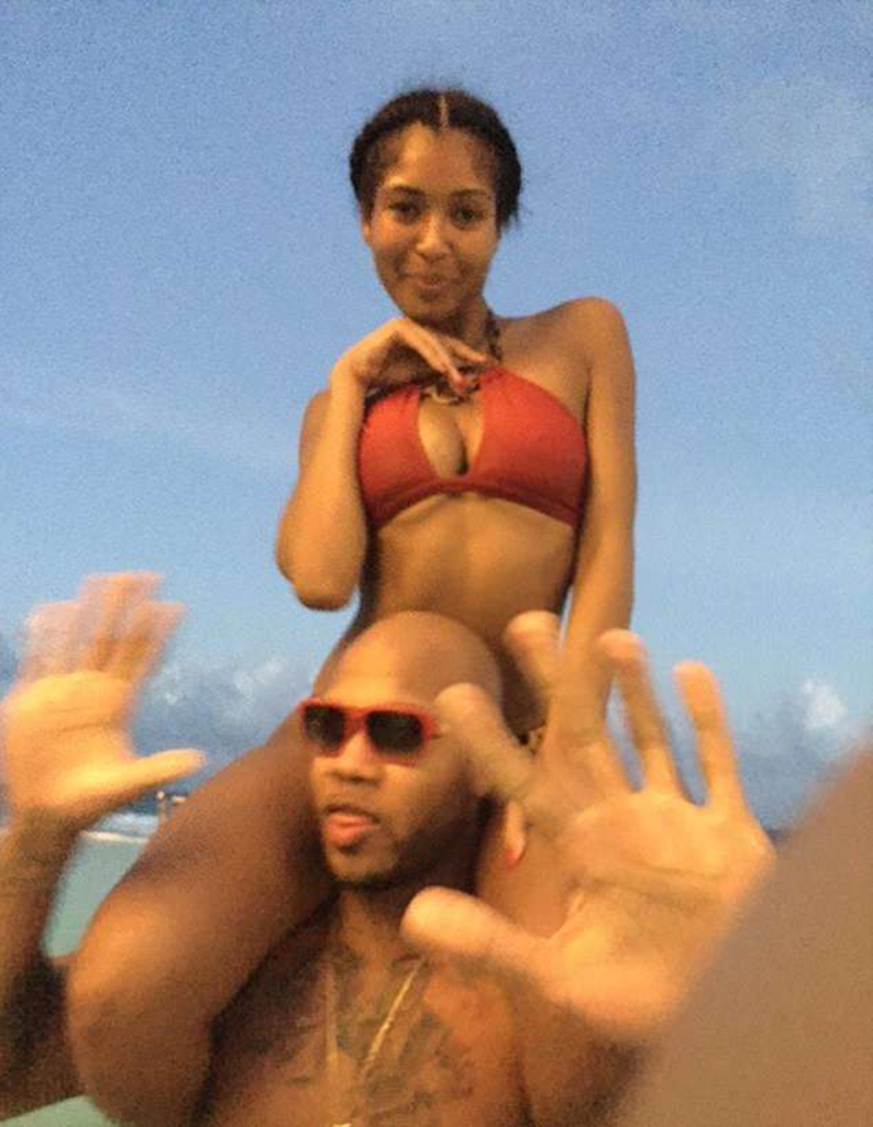Alexis Adams is pictured on Flo Rida's shoulders.