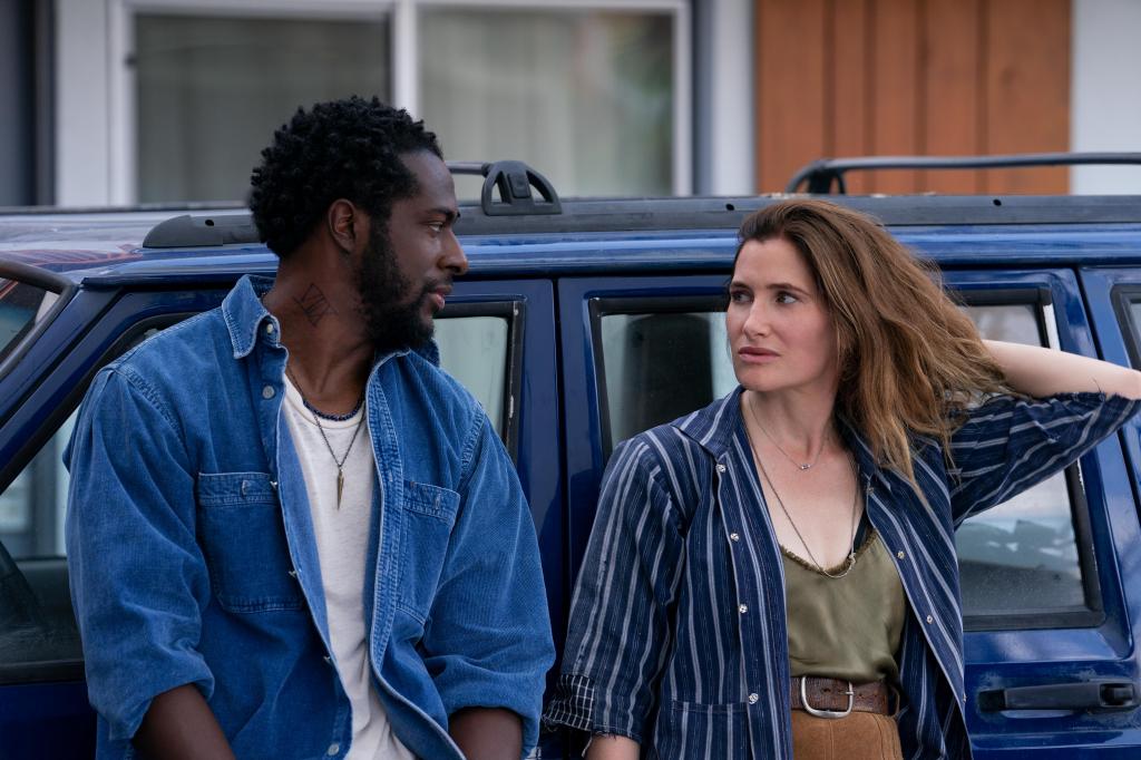 Clare (Kathryn Hahn) and her husband, Danny (Quentin Plair) lean against a car looking at each other. 