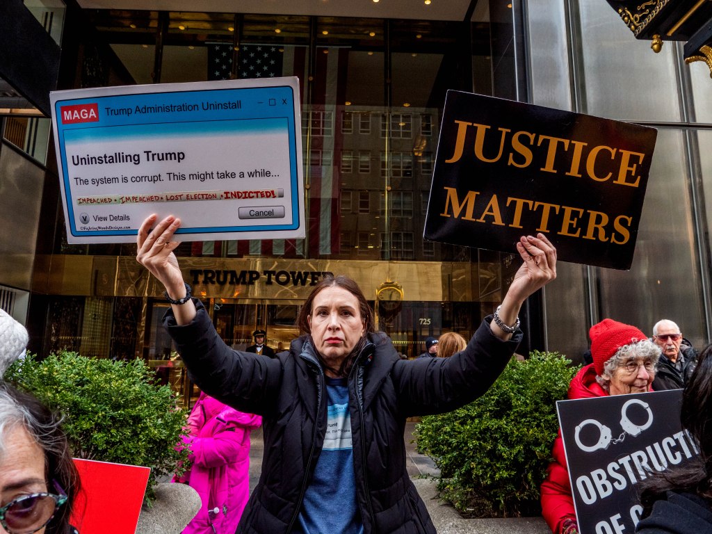 Protesters in front of Trump Tower on Fifth Avenue the day after the indictment of the former president. 