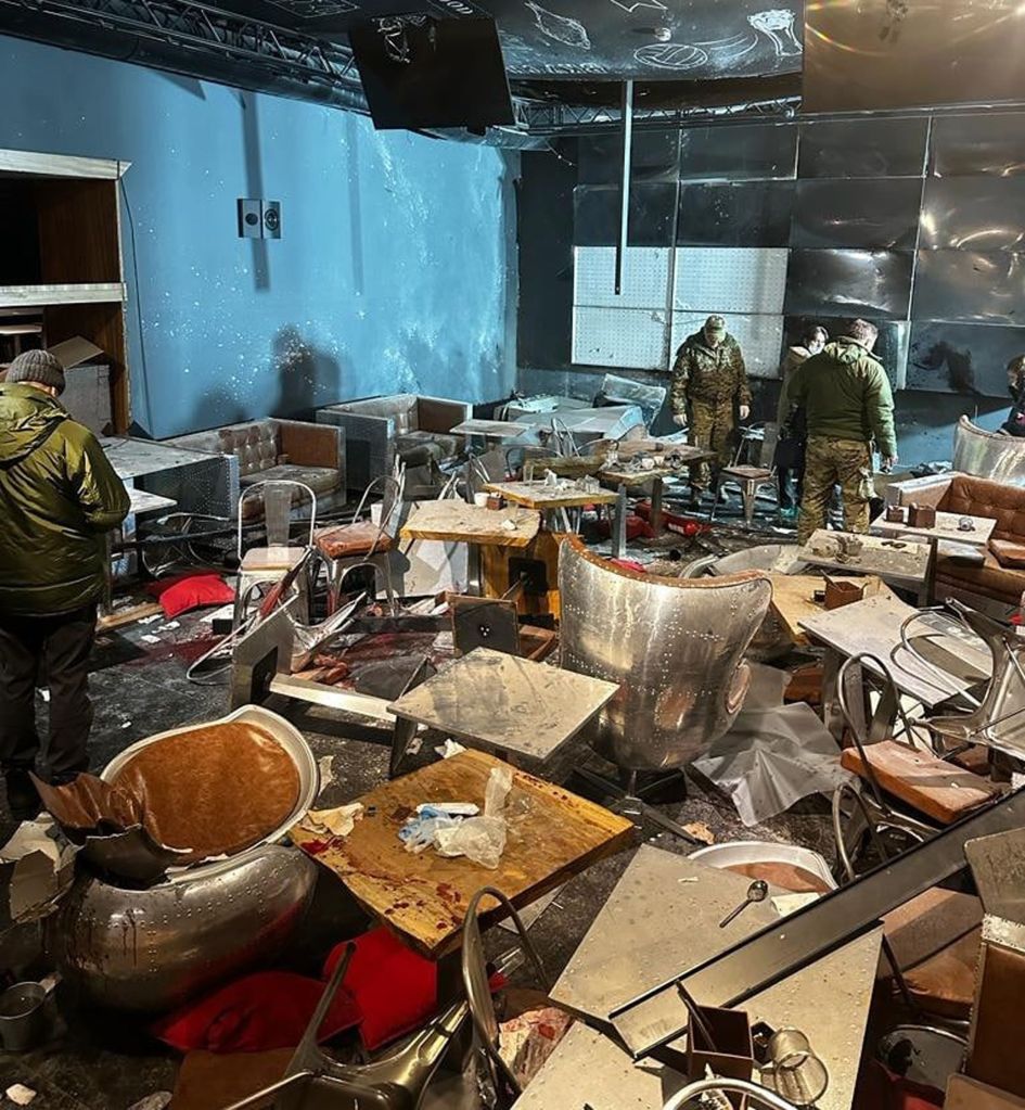 A handout photo made available by The Investigative Committee of the Russian Federation press-service shows, Russian investigators working at the scene of an explosion at the 'Street bar' cafe in St. Petersburg, Russia, 02 April 2023.