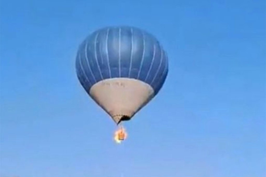 The balloon's basket caught fire shortly after taking off.
