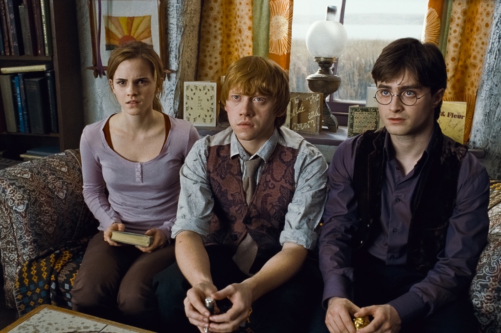 EMMA WATSON as Hermione Granger, RUPERT GRINT as Ron Weasley and DANIEL RADCLIFFE as Harry Potter 