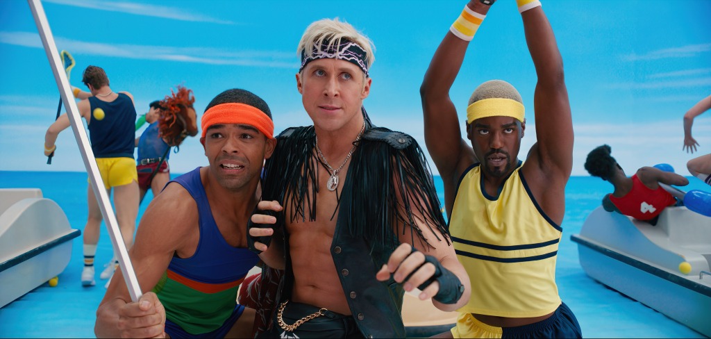 Kingsley Ben-Adir Ryan Gosling and Ncuti Gatwa in "Barbie" wearing campy '80s workout gear, striking poses like they're fighting. 