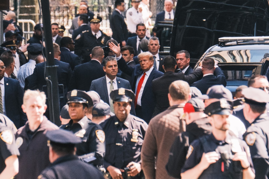 Trump amid the crowd of protestors outside of Manhattan Criminal Court Tuesday. 