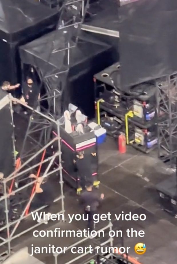 Cleaning cart -- with mops and brooms -- that transports Taylor Swift on stage.