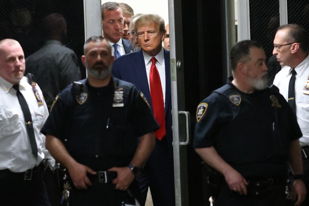 Trump is seen inside the Manhattan Criminal Courthouse on Tuesday afternoon after turning himself in to the authorities.