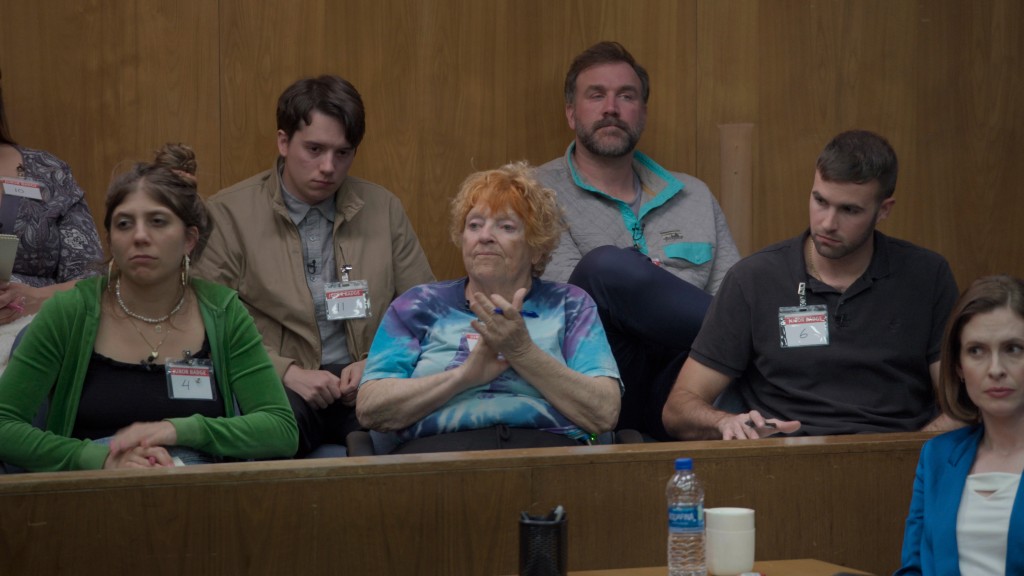  Edy Modica, Mekki Leeper, Susan Berger, Ross Kimball, and Ronald Gladden in "Jury Duty" sitting in a jury box in court. 