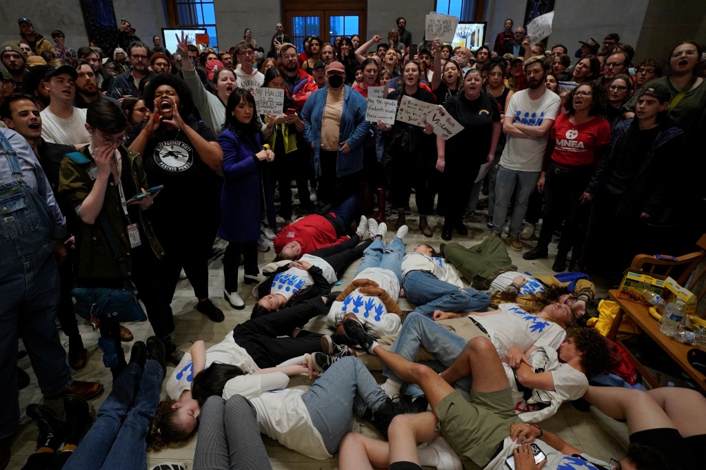 Protesters hold a 'die-in' at the Capitol building. 