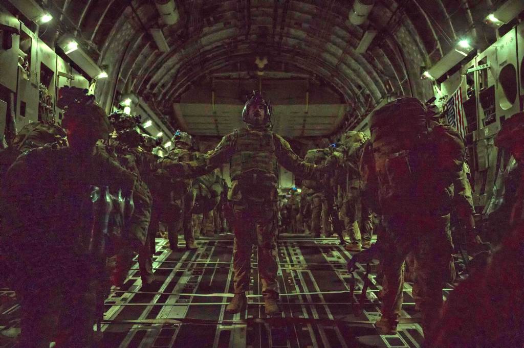 Paratroopers boarding a cargo plane out of Kabul.