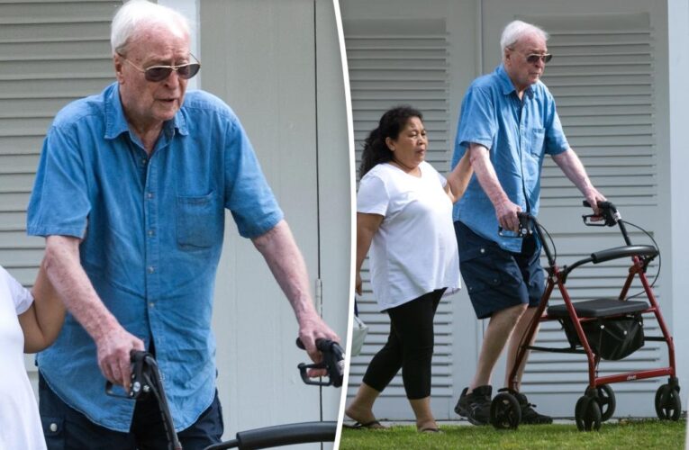 Michael Caine, 90, relaxes at the beach after spinal surgery