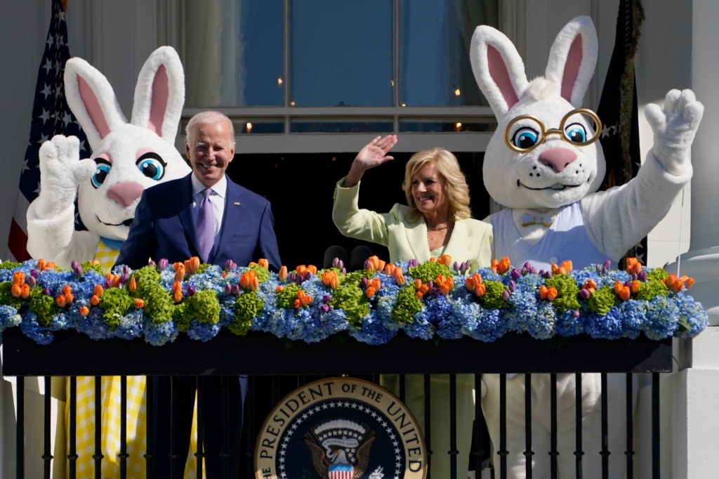 President Joe Biden and first lady Jill Biden stand on the Blue Room Balcony as they attend the 2023 White House Easter Egg Roll.