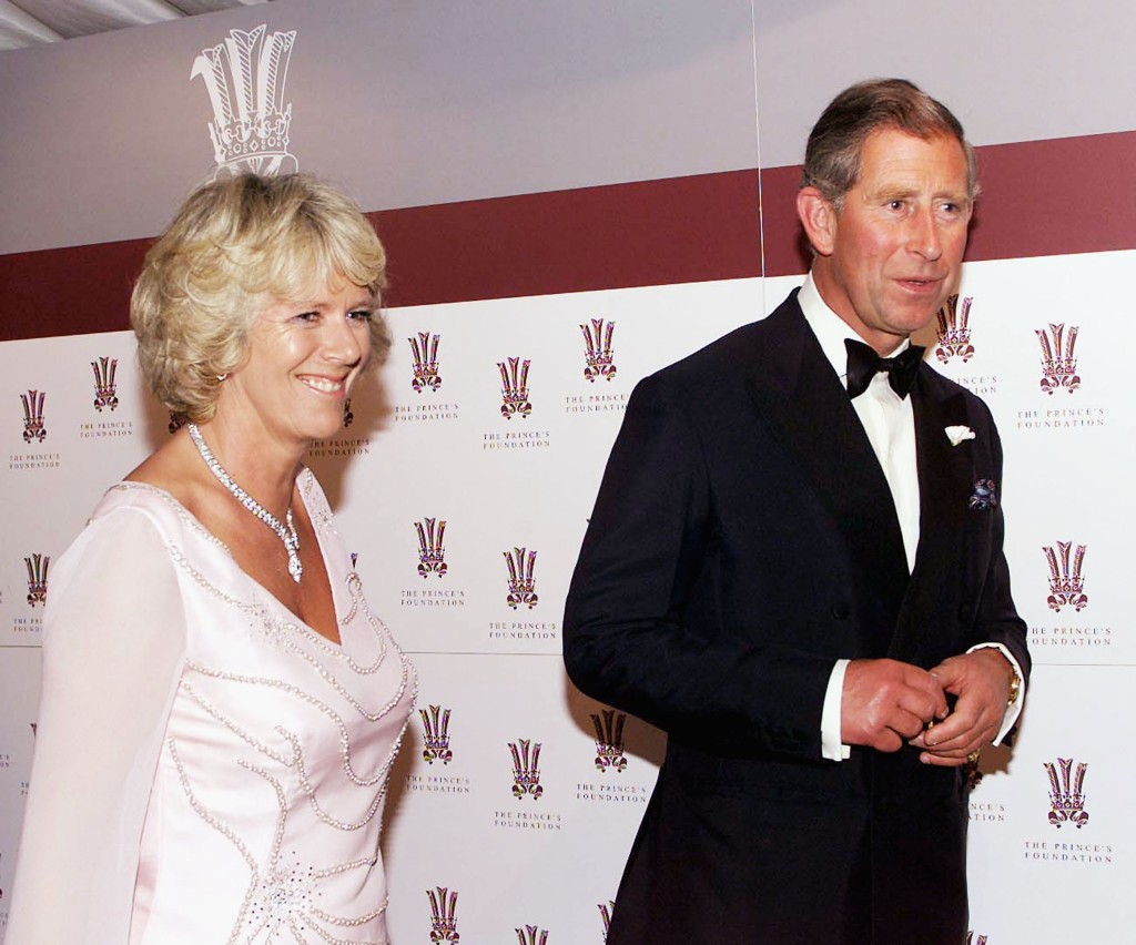 Prince Charles and Camilla Parker-Bowles, with the crown of the Prince's Trust symbol avove her head, attend The Prince's Foundation Gala Dinner on June 20, 2000