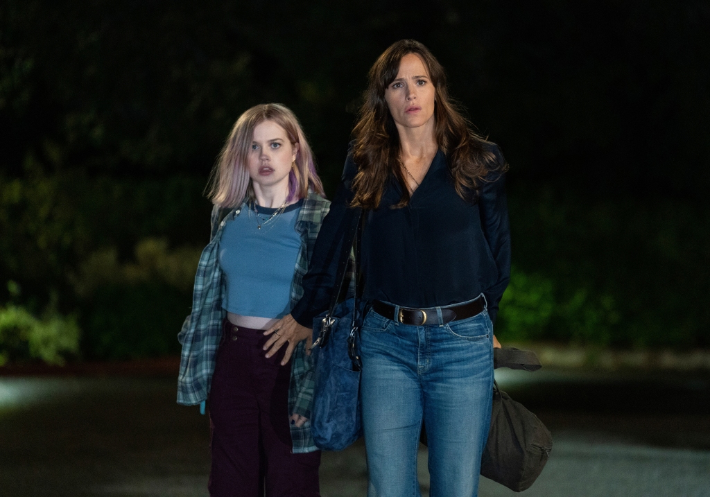 Bailey (Angourie Rice), left, and Hannah (Jennifer Garner), right, stand outside looking worried in "The Last Thing He Told Me." 