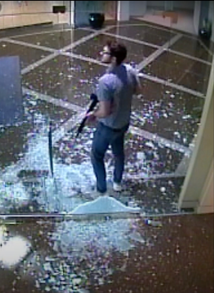 Gunman CONNOR STURGEON  is seen on surveillance video walking armed through Old National Bank on the morning he shot and killed five people in downtown Louisville. 