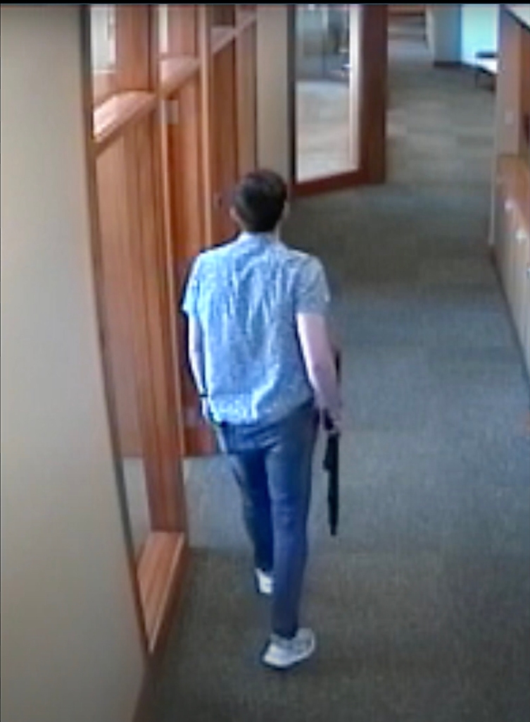 Connor Sturgeon is seen on surveillance video walking armed through Old National Bank on the morning he shot and killed five people.
