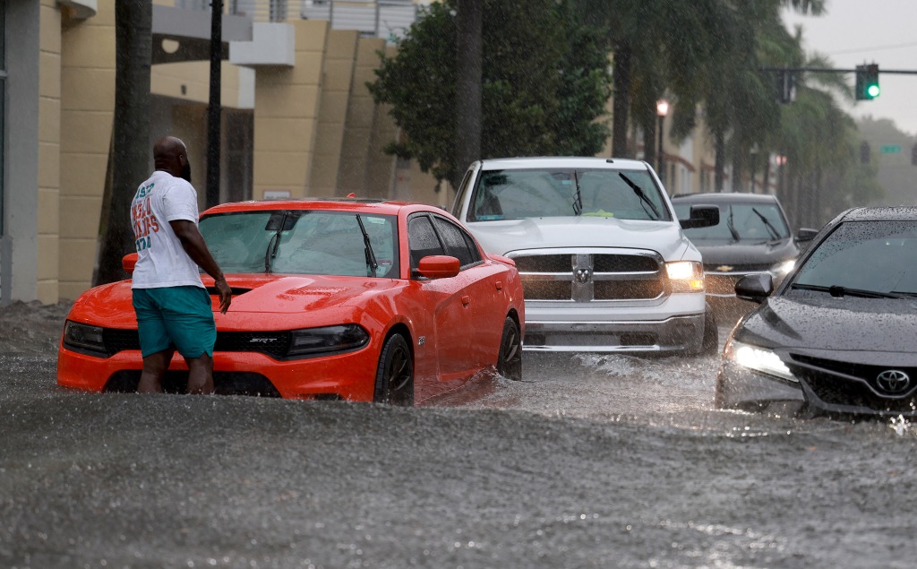 Cars stranded in flooded street