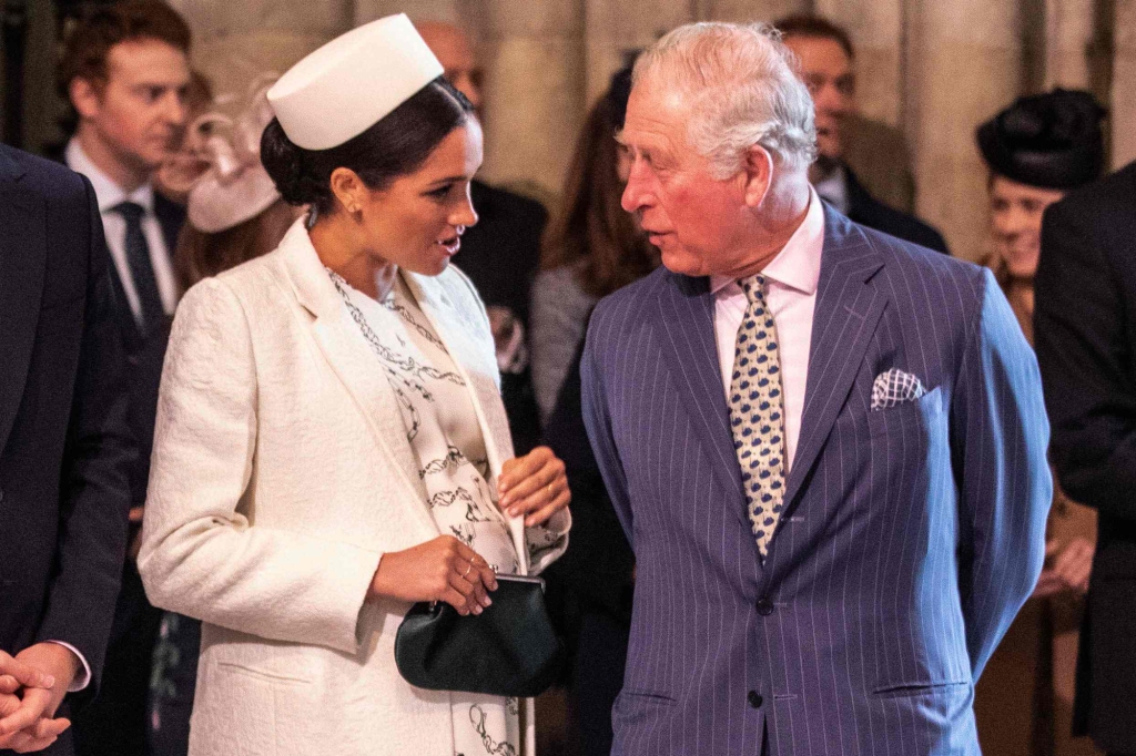 Markle is seen with her father-in-law Charles back in 2019. A source told the Sun that Charles is saddened his daughter-in-law won't be there to witness his coronation. 
