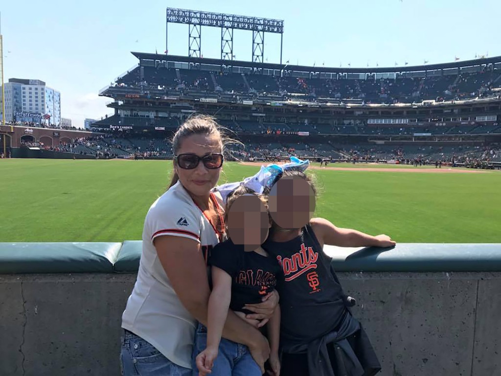 Aurora Regino with her kids at a baseball game