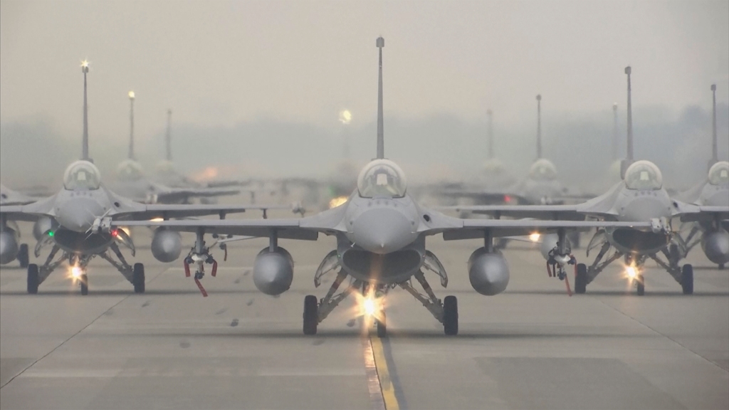 In this image taken from video, Taiwanese Air Force F-16V fighter jets taxi along a runway during a drill in Chiayi in southwestern Taiwan, Wednesday, Jan. 5, 2022. 