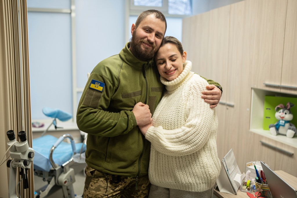 Vitalii Khroniuk and his partner Anna Sokurenko hug during their visit to IVMED's fertility clinic in early February. 