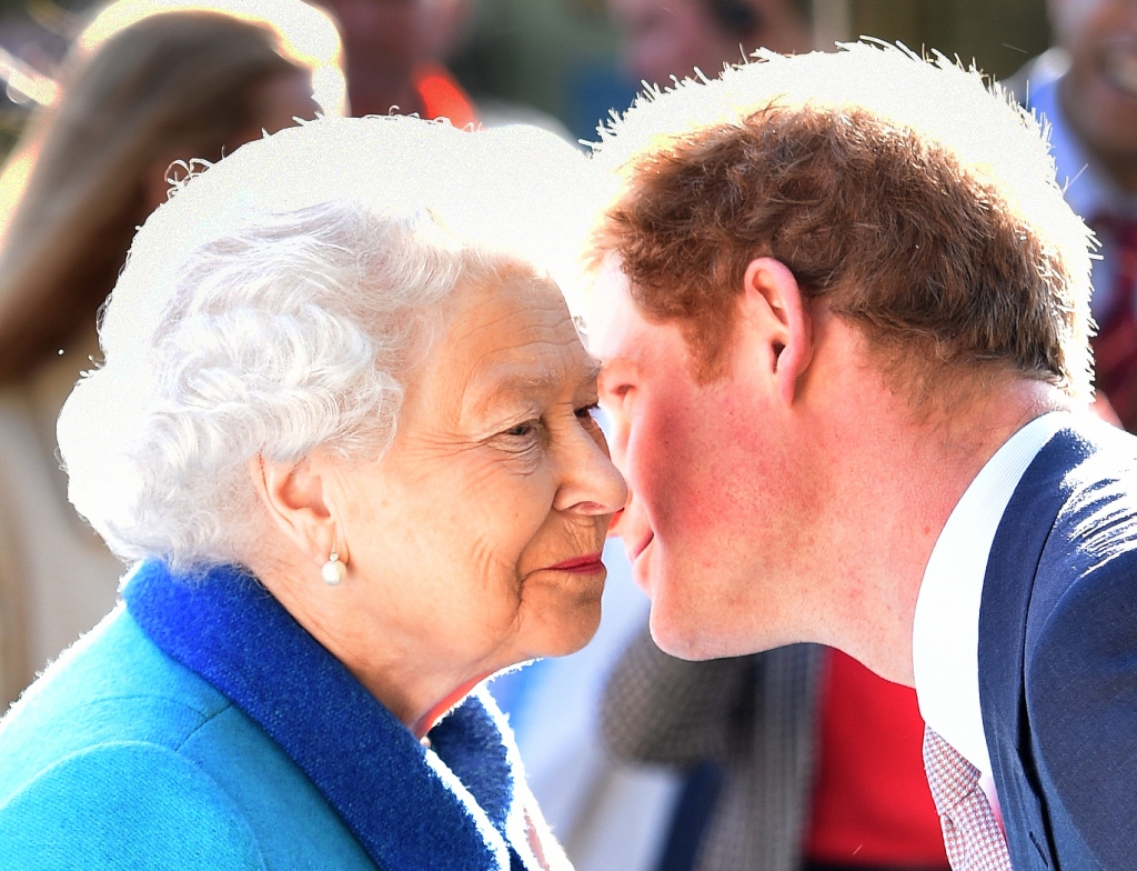 Queen Elizabeth and Prince Harry whispering together. 