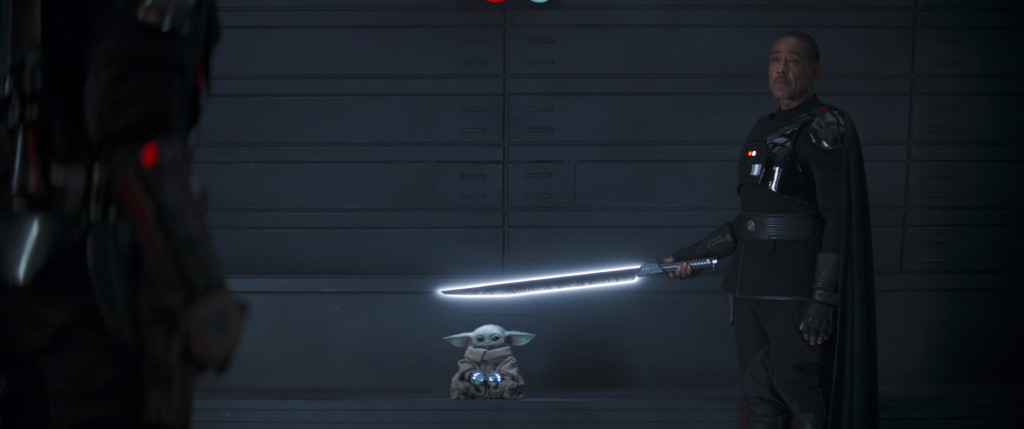The scene Esposito (right) is referencing takes place during the show's climatic season two finale where Gideon uses his special lightsaber — known in the "Star Wars" universe as the Dark Saber — against Din Djarin (left)(played by Pedro Pascal).
