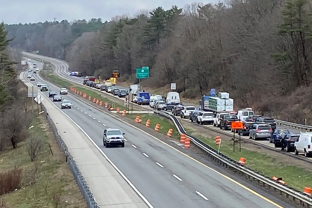 traffic is backed up near a scene where people were injured in a shooting on Interstate 295, in Yarmouth, Maine