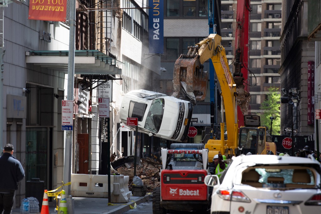 A preliminary FDNY report concluded that the deadly collapse was likely caused by the building’s age and the number of cars on its top deck.