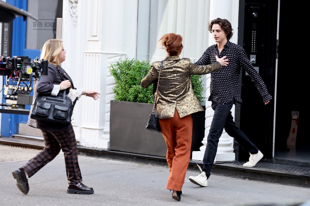 Chalamet exits a building and is approached by actress Stephanie Kurtzuba before the mishap.