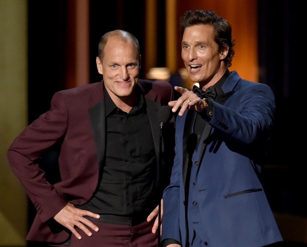 Woody Harrelson and Matthew McConaughey dressed in suits.