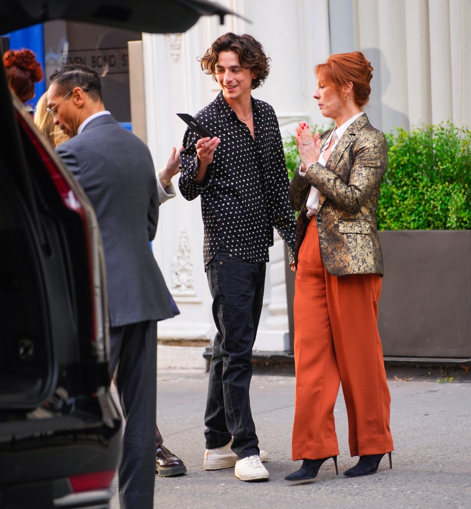 Chalamet holds a piece of equipment that dislodged from the camera.