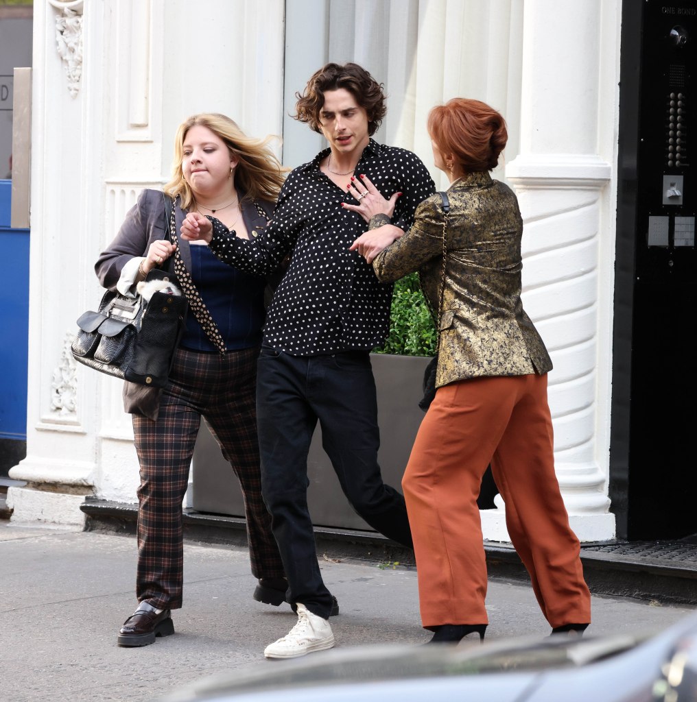 Chalamet moves through the scene with Kurtzuba (right) and another actor purported to be Francesca Scorsese.