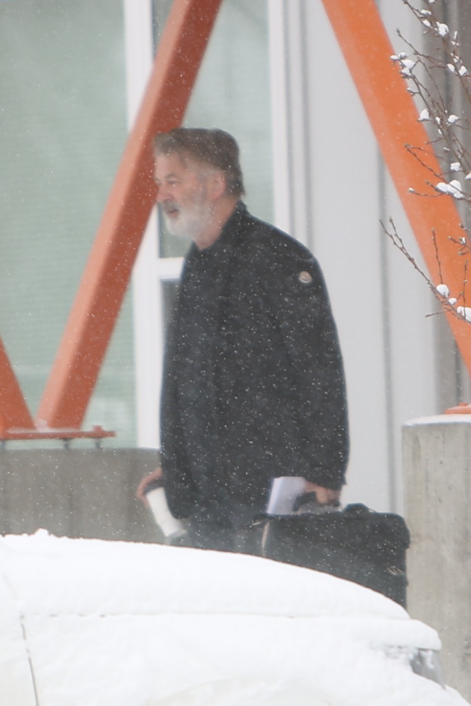 Alec Baldwin was spotted carrying a coffee cup and briefcase as he headed to the new "Rust" movie set in Montana Friday.
