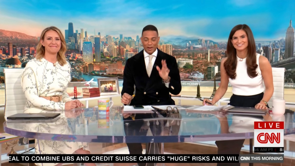 Poppy Harlow, Don Lemon and Kaitlan Collins sit at a table on the set of CNN This Morning