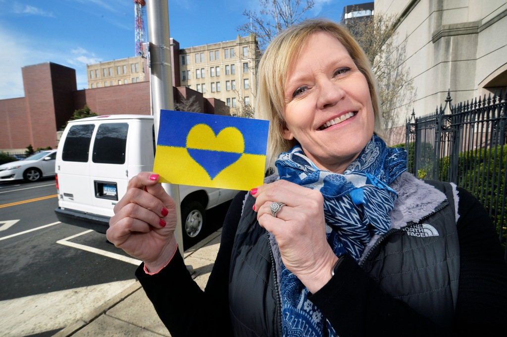 James Vasquez's ex-wife Tina proudly holds a Ukraine image before findingf out her husband had long lied to her about his past.
