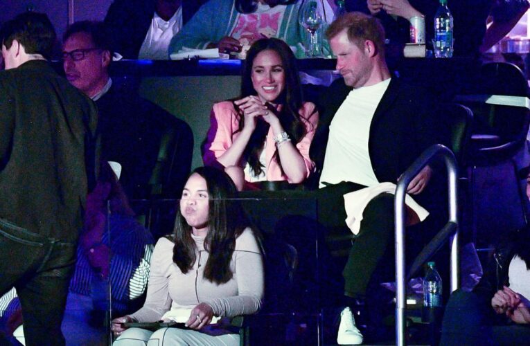 What Harry and Meghan whispered to each other at Lakers game: lip readers