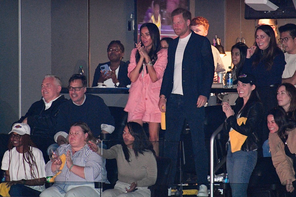 What Harry and Meghan really whispered to each other at Lakers game, according to lip readers