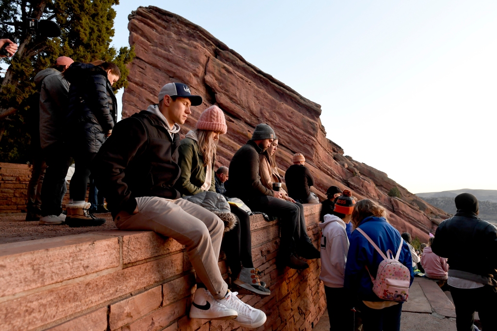 MORRISON, CO - APRIL 17:  People close their eyes in a moment of prayer during the 75th annual Easter Sunrise service at Red Rocks Park and Amphitheatre on April 17, 2022 in Morrison, Colorado. This is the first time services have been held since 2019 after a two year hiatus due to the pandemic. The services are put on by the Colorado Council of Churches. Vocalist Sheryl Renee performed pre-service music.  Reverend Dr. John J. Yu gave the sermon entitled "New Life".  Yu serves at the lead pastor of Time Light Community Church in Aurora. The Blood Brothers played before and after the service as well as playing the offertory.  (Photo by Helen H. Richardson/MediaNews Group/The Denver Post via Getty Images)