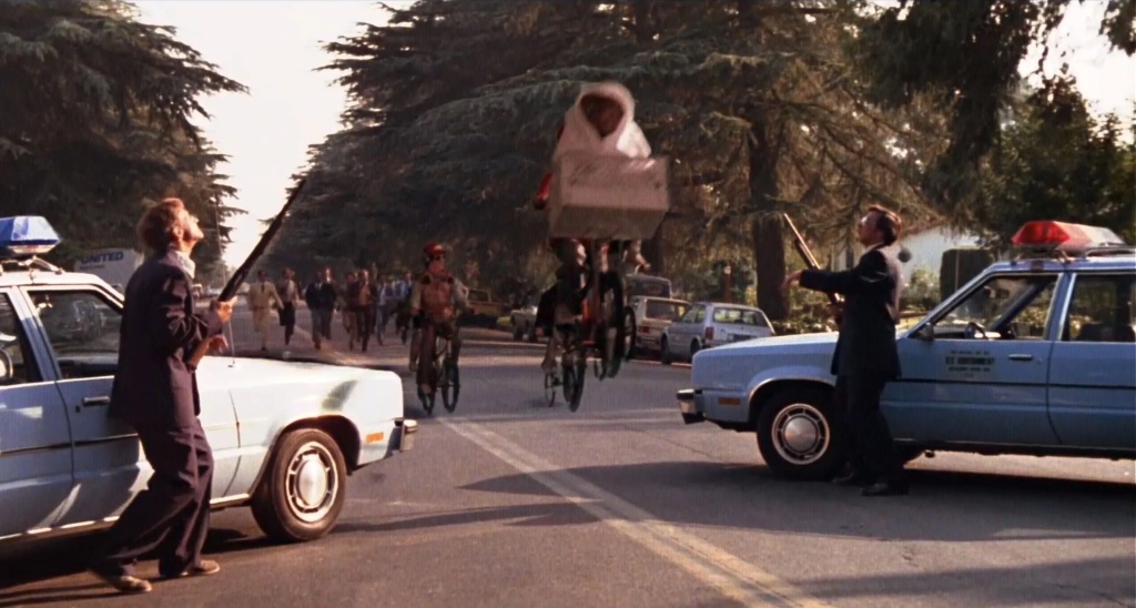 One particular scene in "E.T." showed the agents chase children while carrying guns.