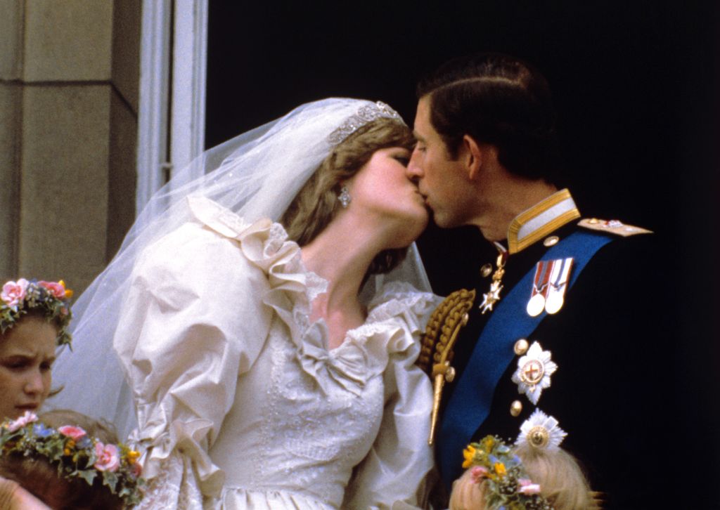 Princess Diana and Prince Charles kiss at their wedding. 