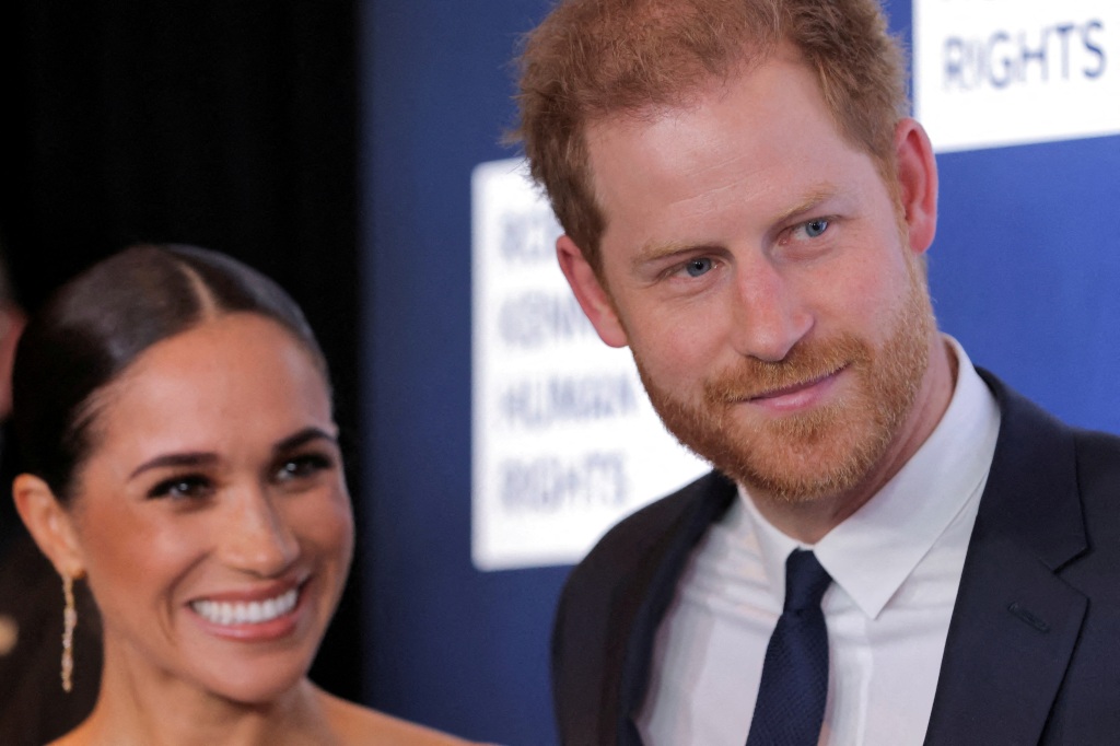 Meghan Markle and Prince Harry smiling. 