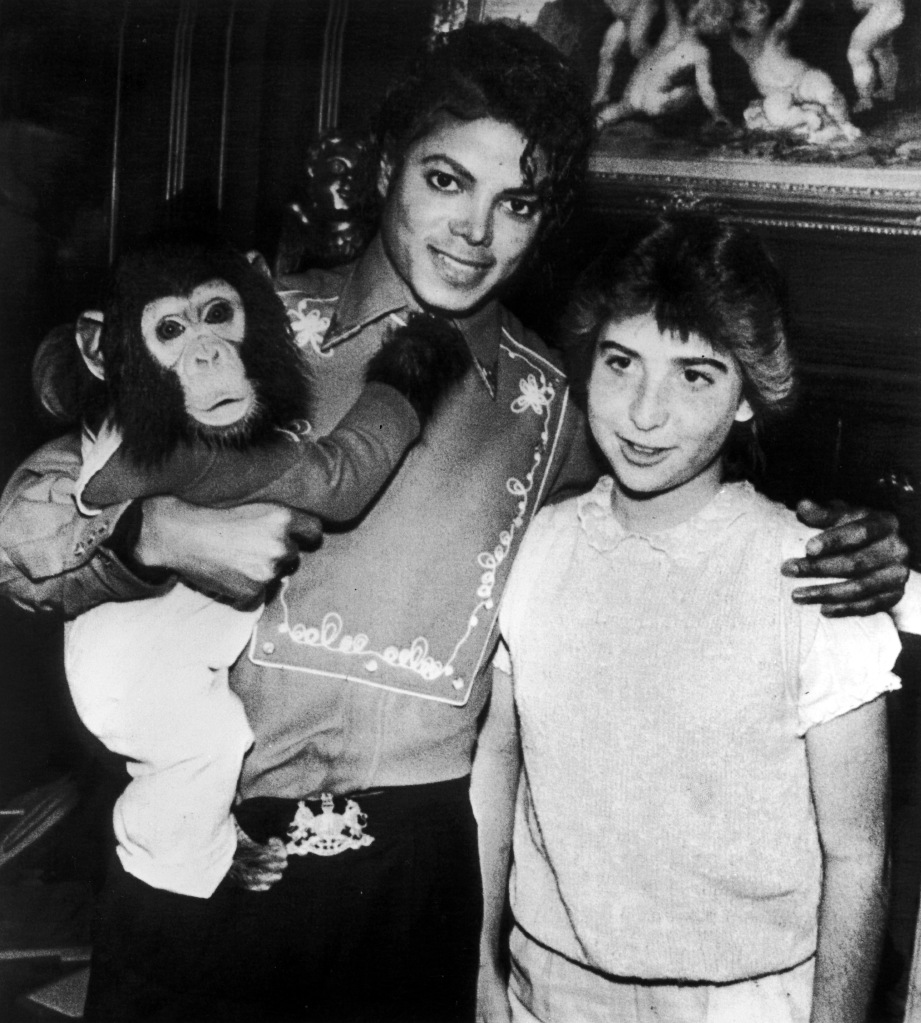 Michael Jackson poses with 14-year-old fan Donna Ashlock and his pet chimpanzee Bubbles at the Neverland Ranch in Santa Barbara County, California, 8th March 1986. 
