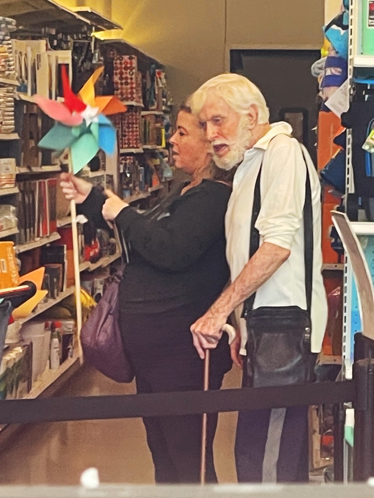 Silver, 51, and her husband were then seen playing with a paper windmill as they stood in the checkout line. 