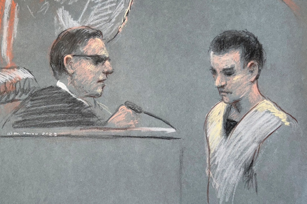 Massachusetts Air National Guardsman Jack Teixeira, right, appears in U.S. District Court in Boston, Friday, April 14, 2023