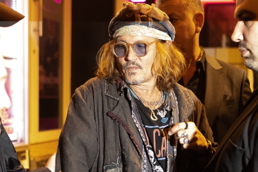 Al Pacino and Johnny Depp leave the private screening and master class of the film "Donnie Brasco" at the Pantheon cinema in Paris on April 26, 2023.